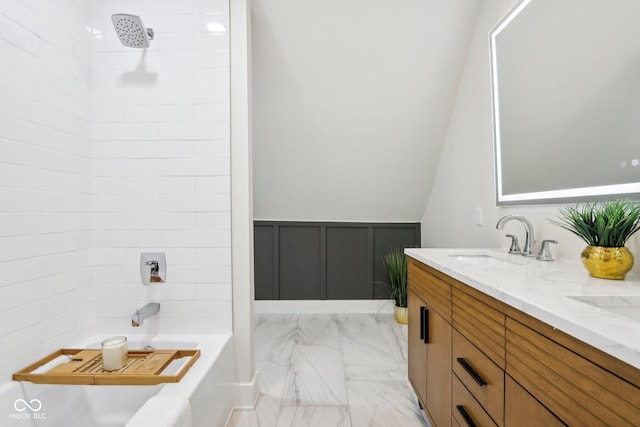 560 Jefferson Ave, Indianapolis, IN 46201 - full bath featuring marble look tiles, double vanity, a decorative wall, wainscoting, and  shower combination