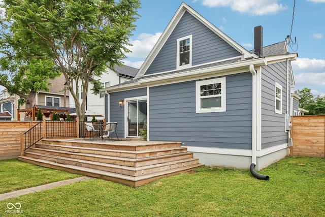 560 Jefferson Ave, Indianapolis, IN 46201 - rear view of house with a deck, a chimney, and a shingled roof