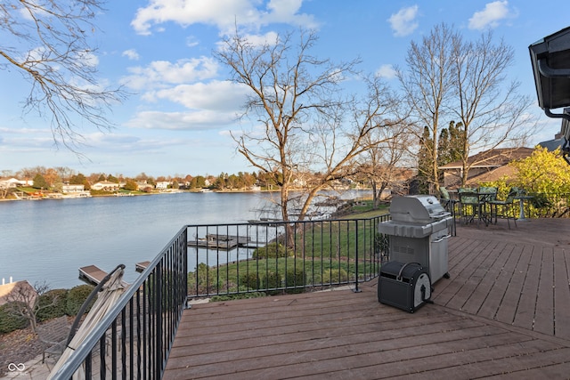 wooden deck with a water view