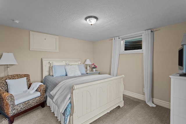 carpeted bedroom featuring a textured ceiling