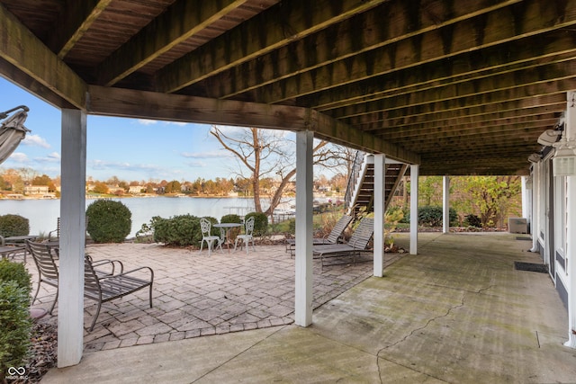 view of patio / terrace with a water view