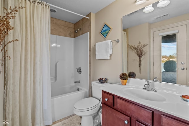 full bathroom with shower / bath combo with shower curtain, vanity, and toilet