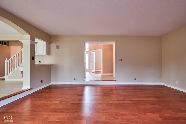 empty room with wood-type flooring