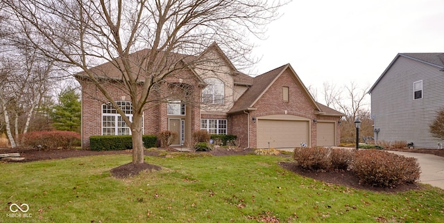 view of front of house featuring a front yard and a garage