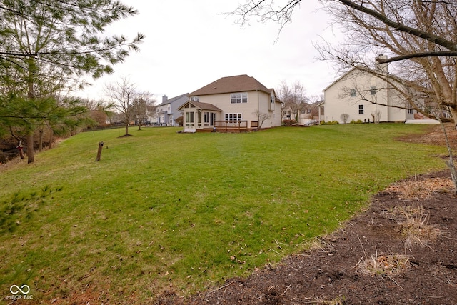 view of yard featuring a wooden deck