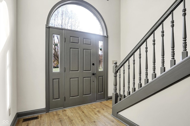 foyer entrance with light hardwood / wood-style flooring