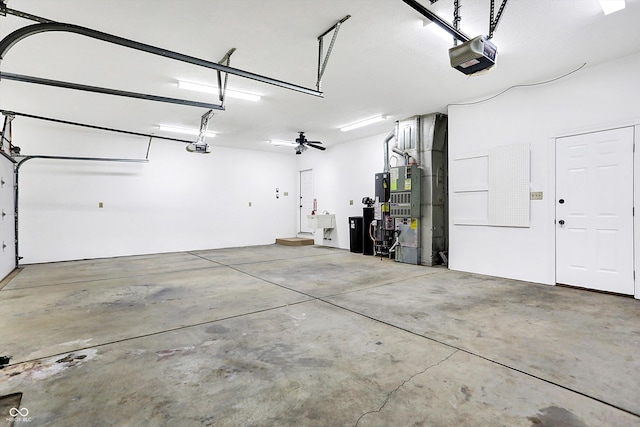 garage with ceiling fan and a garage door opener