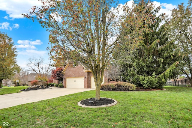 obstructed view of property with a garage and a front lawn