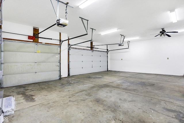 garage with ceiling fan and a garage door opener