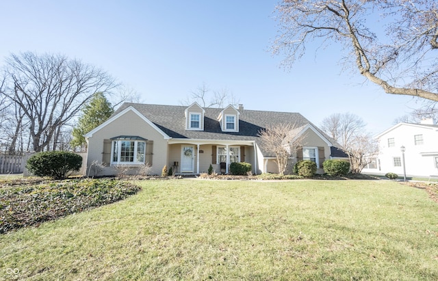 new england style home featuring a front yard