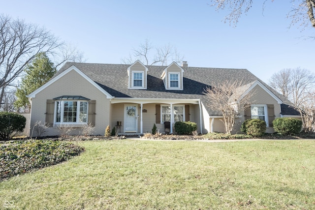 new england style home featuring a front yard