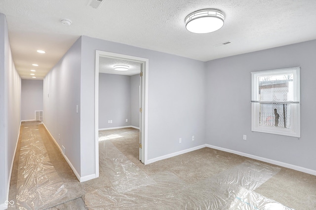 empty room with a textured ceiling