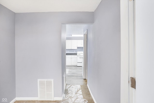 corridor featuring light hardwood / wood-style flooring