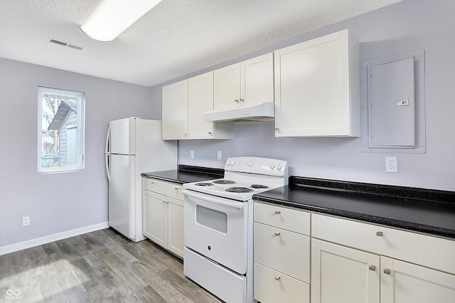 kitchen with white cabinets and white appliances