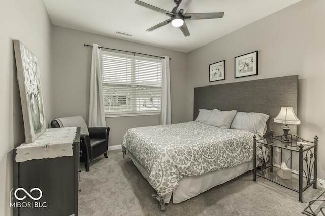 bedroom featuring ceiling fan and light carpet