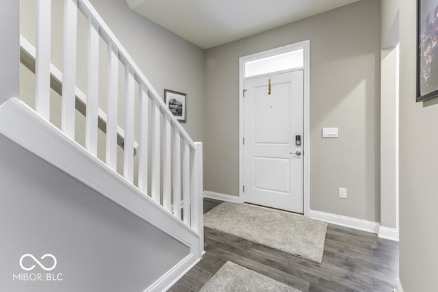 entrance foyer with dark hardwood / wood-style flooring