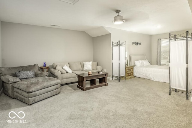 bedroom featuring ceiling fan, carpet floors, and vaulted ceiling