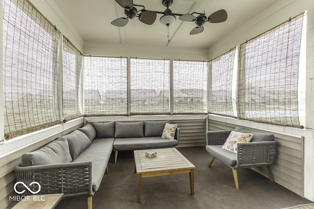 sunroom / solarium with plenty of natural light and ceiling fan