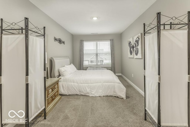 bedroom featuring light colored carpet