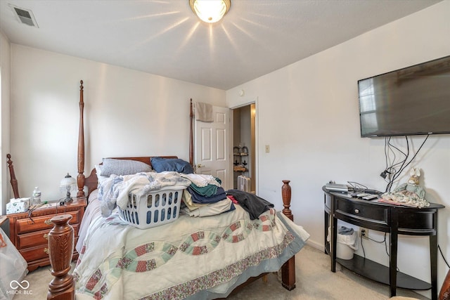 bedroom with light colored carpet