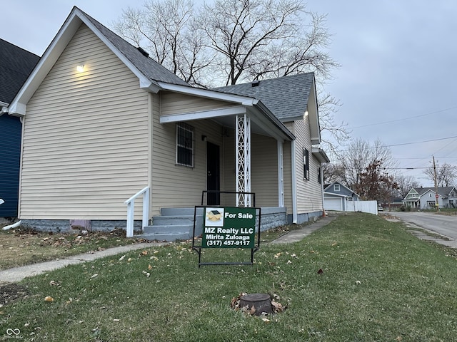 view of side of home featuring a yard