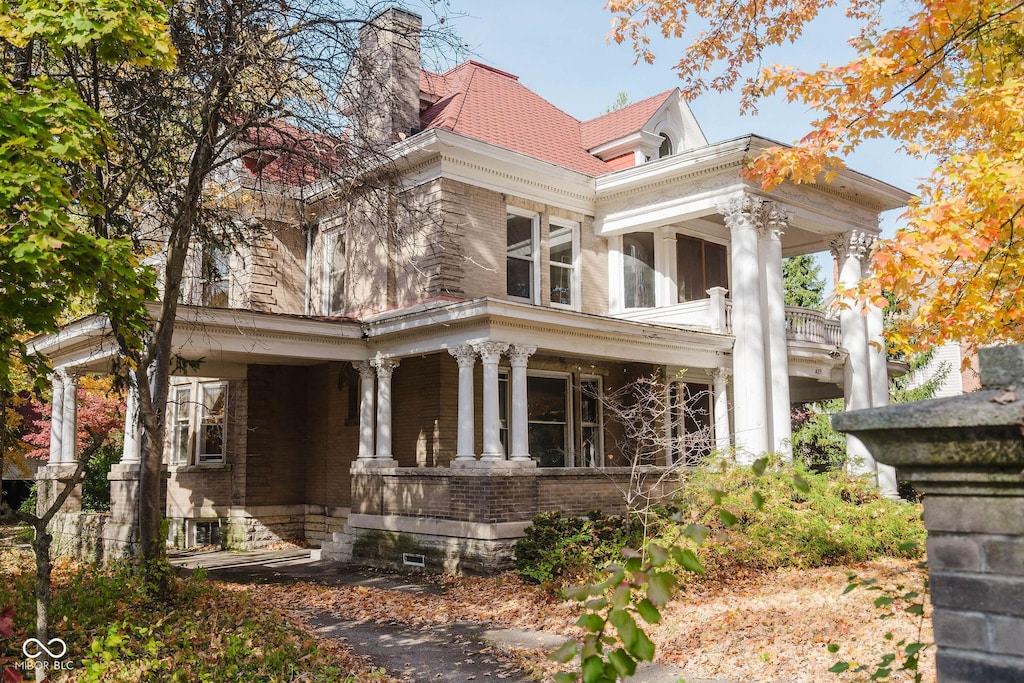 425 S Main St, New Castle, IN 47362 - view of front of property featuring a porch, brick siding, and a chimney