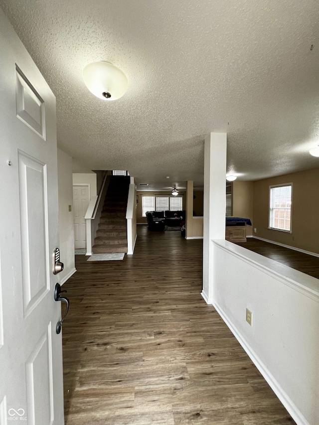 foyer with hardwood / wood-style flooring, a textured ceiling, and pool table