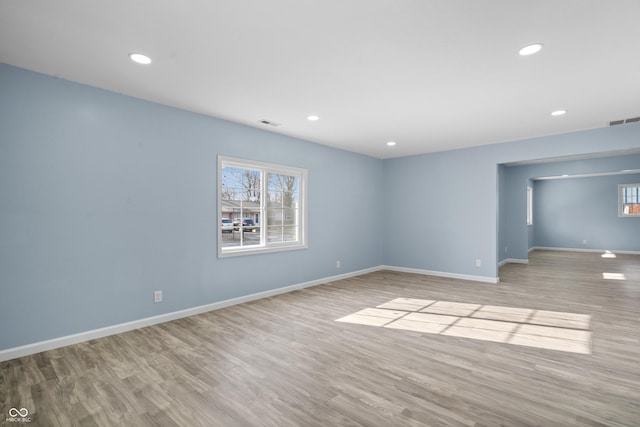 spare room featuring light hardwood / wood-style flooring