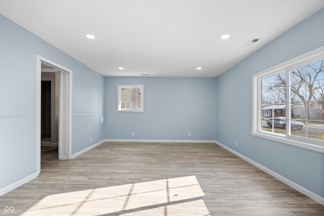 spare room featuring light hardwood / wood-style flooring