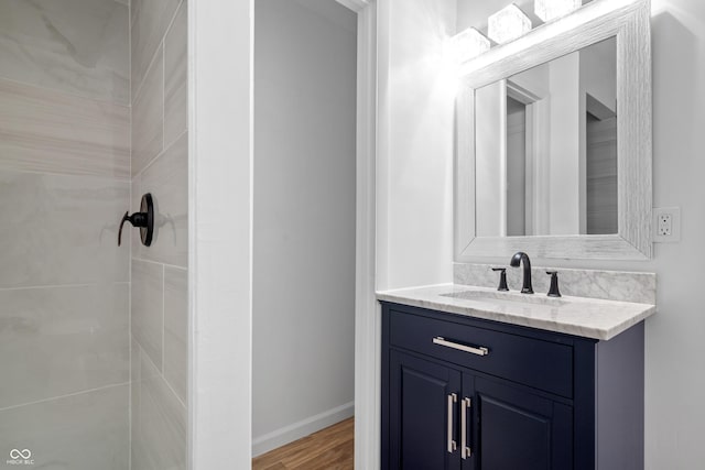 bathroom featuring wood-type flooring and vanity