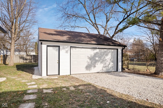 garage featuring a yard