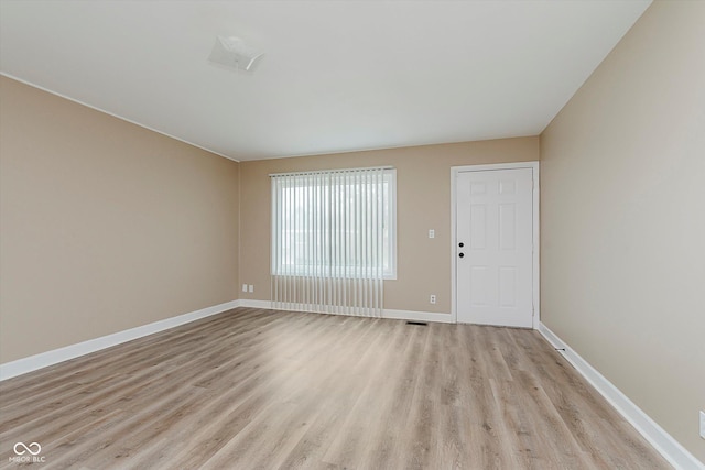 unfurnished room with light hardwood / wood-style flooring