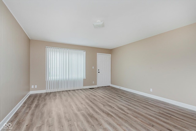 unfurnished room featuring light hardwood / wood-style flooring