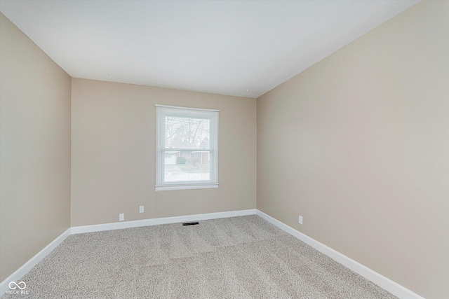 empty room with light colored carpet