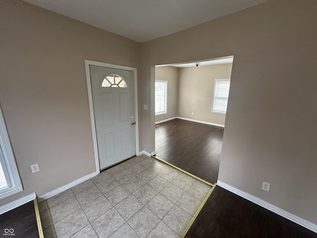 foyer entrance with light wood-type flooring