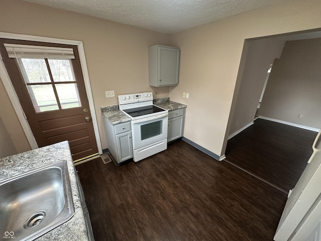 kitchen with gray cabinetry, white range with electric cooktop, sink, a textured ceiling, and dark hardwood / wood-style flooring