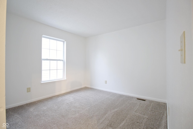 unfurnished room featuring carpet floors