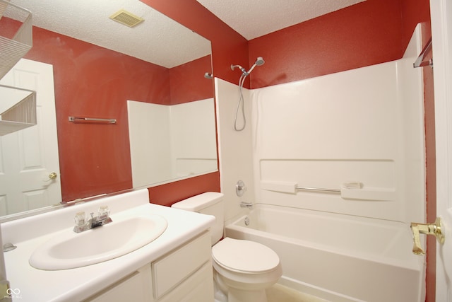 full bathroom with vanity, toilet, shower / bath combination, and a textured ceiling