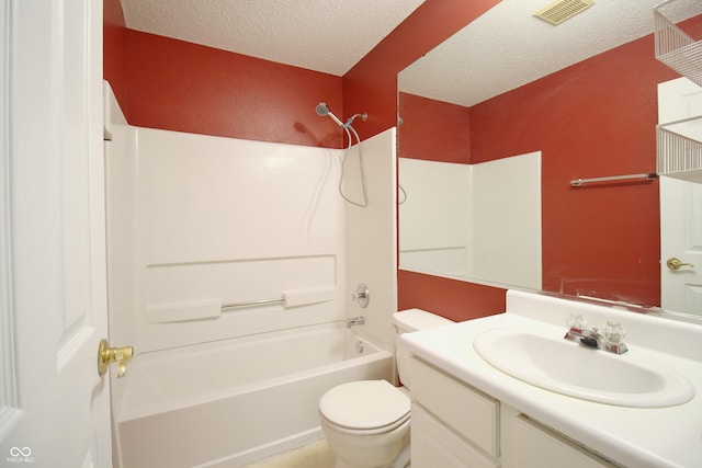 full bathroom with bathtub / shower combination, vanity, a textured ceiling, and toilet