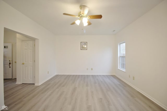 empty room featuring ceiling fan and light hardwood / wood-style floors