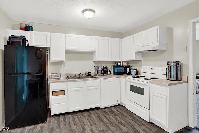 kitchen featuring sink, white cabinetry, custom exhaust hood, and black appliances