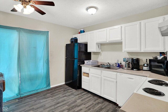 kitchen featuring white cabinetry, sink, black fridge, white dishwasher, and a textured ceiling