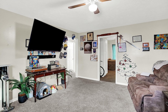 living room with carpet flooring and ceiling fan