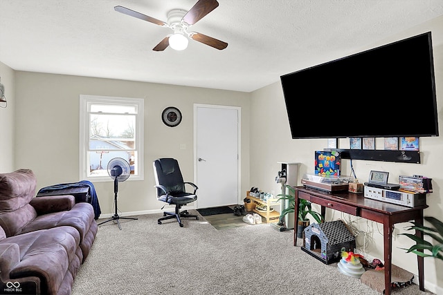 office with a textured ceiling, carpet floors, and ceiling fan