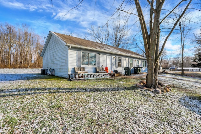 ranch-style house featuring central air condition unit