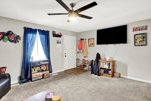 game room with ceiling fan and carpet floors