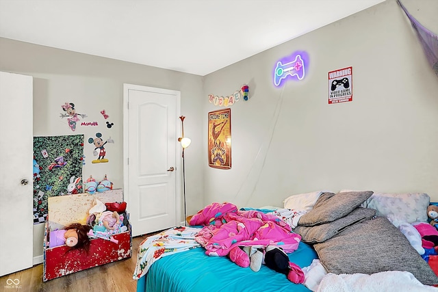 bedroom with hardwood / wood-style flooring