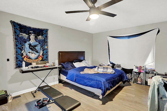 bedroom featuring hardwood / wood-style floors and ceiling fan