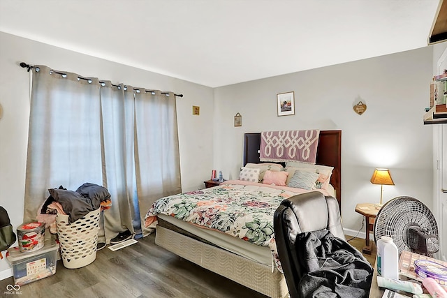 bedroom with wood-type flooring