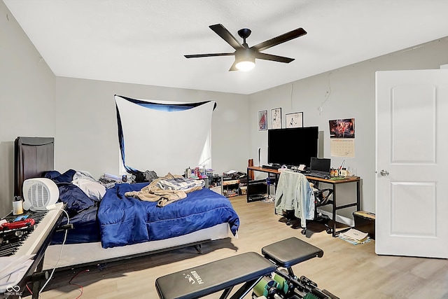 bedroom featuring ceiling fan and light hardwood / wood-style flooring